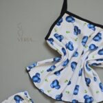ست تاپ شورت طرح میوه‌ای با نقوش آبی روی زمینه راه راه سفید برند ویریا